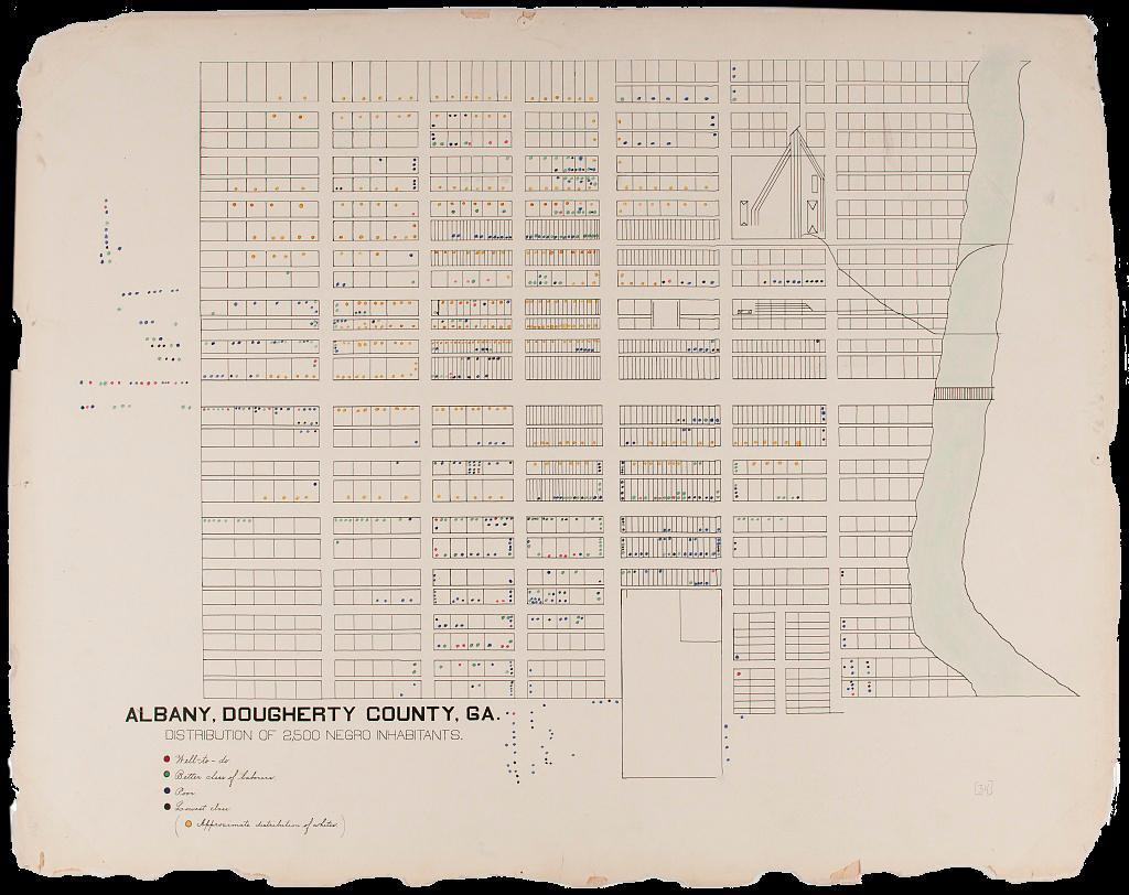A map of the class distribution in Black communities of Albany, Georgia, a city within Dougherty County. To the right, a drawing of a river borders the county line, and various colored dots indicate four class categories. According to Du Bois and his team, the classes represented are described as follows in a scripted hand: red dots signal “well-to-do” inhabitants, green shows the “better class for laborers,” blue indicates the “poor” class, black is for the “lowest class,” and yellow (listed off to the side in brackets) is to differentiate the white residences. Clusters of predominantly blue, black, and yellow concentrate in the middle of the grid where the bulk of the city’s population resides, while on the outskirts less frequent dots are gathered. On the periphery of the grid to the left, a small cluster of red, green, and blue dots linger.