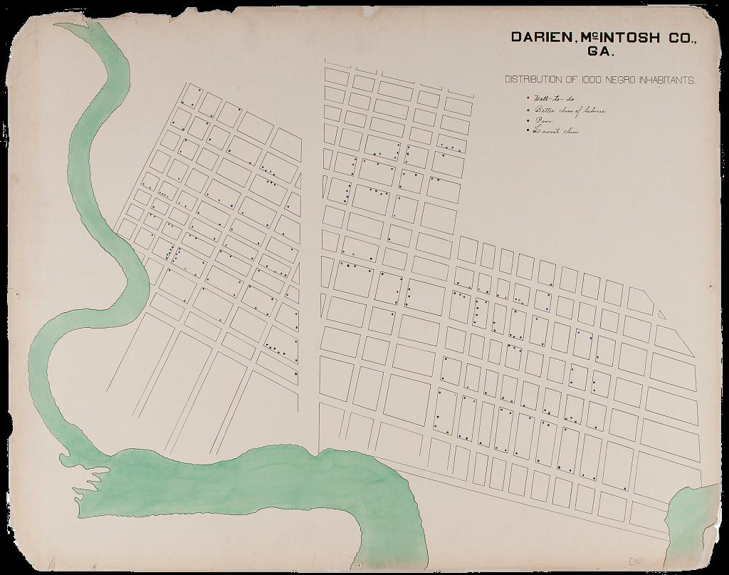 A map of Darien, GA, a city within McIntosh County, that depicts the distribution of 1,000 Black inhabitants. Drawn diagonally and up-close to show the streets of the city, four color-coded dots fill in the grid: red dots correspond to “well-to-do” inhabitants, green symbolizes the “better class of laborers,” blue indicates the “poor,” and black depicts the “lowest class.” A curving river colored in a light green borders the bottom and left sides of the town.